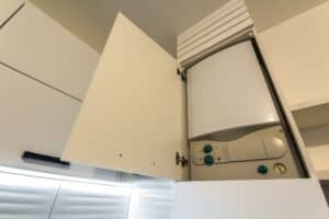 Home gas water heater boiler in kitchen furniture for apartment of home heating