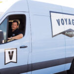 Voyager truck branded arriving at customer home for plumbing services