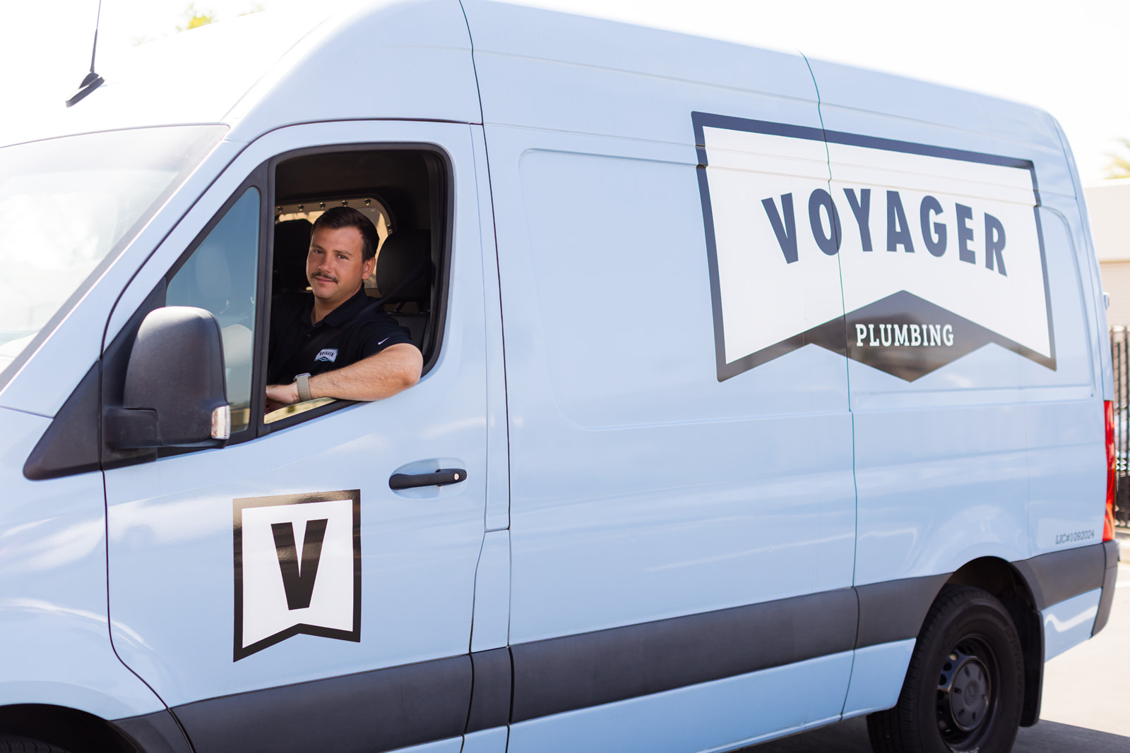Voyager truck branded arriving at customer home for plumbing services