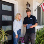 Happy Voyager Plumbing Customer being shown options for plumbing services