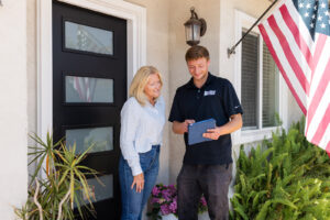 Happy Voyager Plumbing Customer being shown options for plumbing services