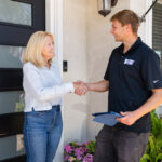 Customer buying plumbing services from Voyager Employee