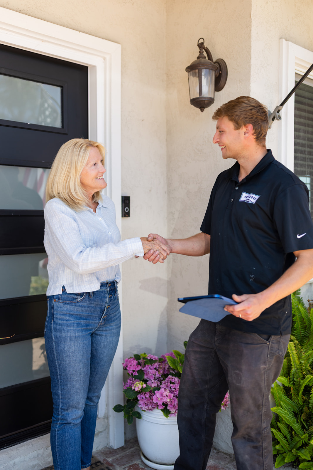 Customer buying plumbing services from Voyager Employee