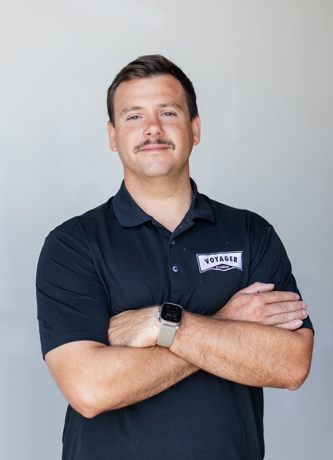 Voyager Plumbing Owner - Portrait with crossed arms