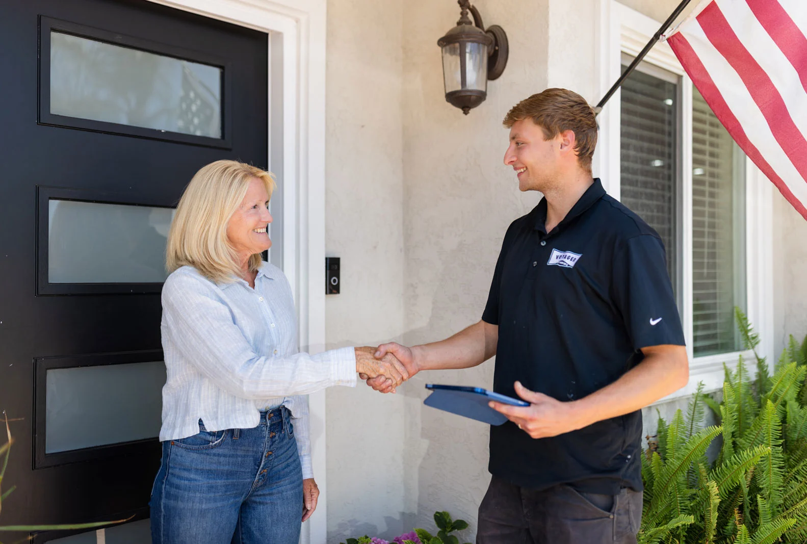 technician with happy plumbing customer